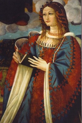 Image shows the Madonna with red hair and a red and blue robe