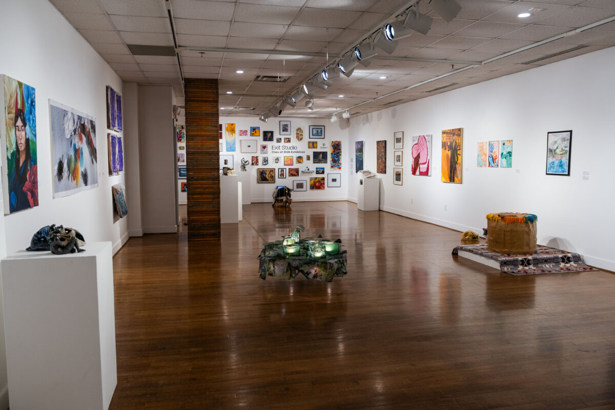 Inside gallery space with art on the walls