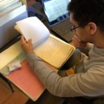 Student reviews documents at the National Archives