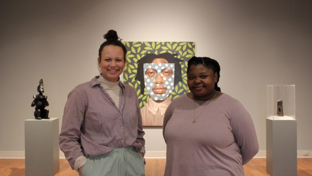 Left to right UMW students Lauryn Taylor and Jordan Hadler pose in the exhibit Healing through the Preservation of our Histories and our selves