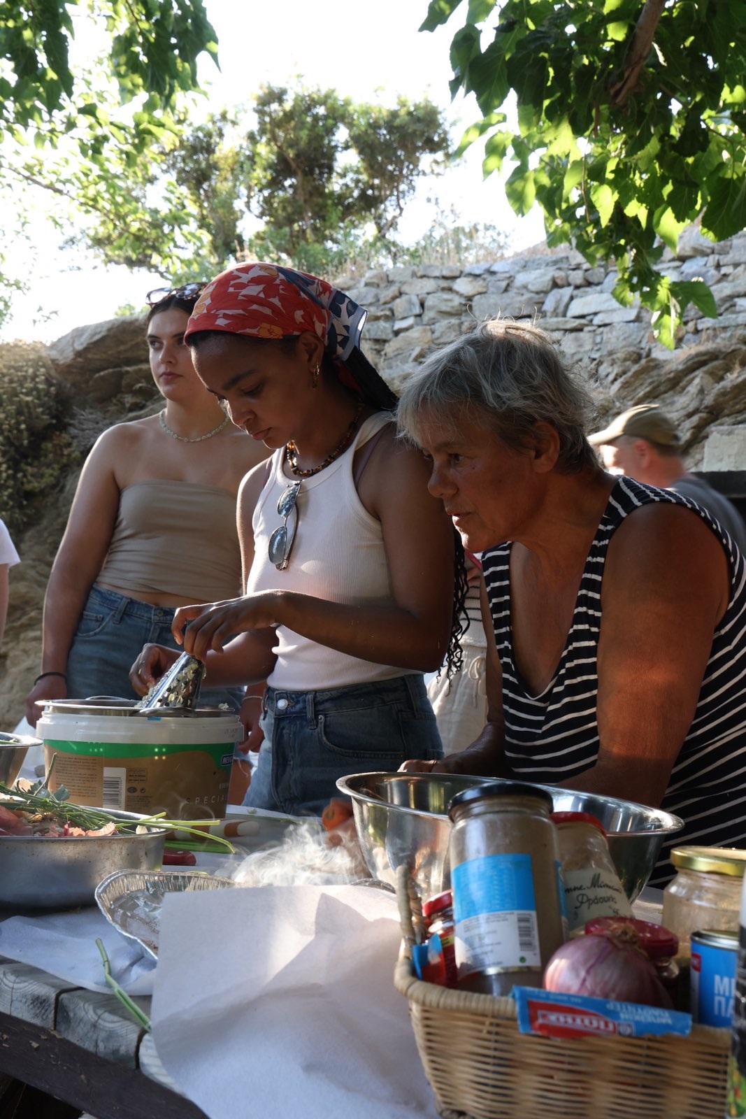 Ariana Adamek prepping food in Greece with locals and other students