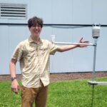 Senior Physics major Joe Haun tests out his experiment at Coastal Carolona