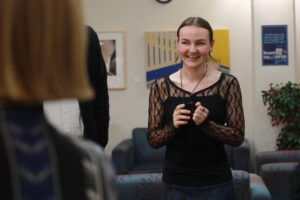 Madison Hinton speaks about her art at the RCC open house