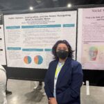 student presents poster