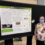 student presents poster at NCUR conference.