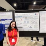 student presents poster