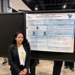 student presents poster