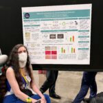 student presents poster