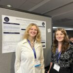 Students Ashton Crawfordd and Juniper Creskoff stand in front of a poster a the MAA conference