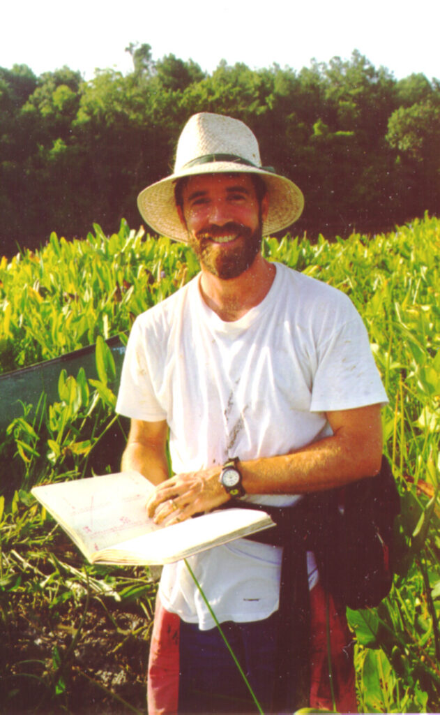 Photo of Dr. Griffith doing botany field work
