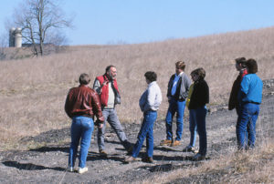 Marshall with students in the field