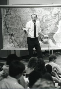 Marshall Bowen in front of US map teaching a class