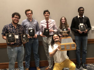 Students winners of Geography Bowl competition pose with award plaques and silver bowl