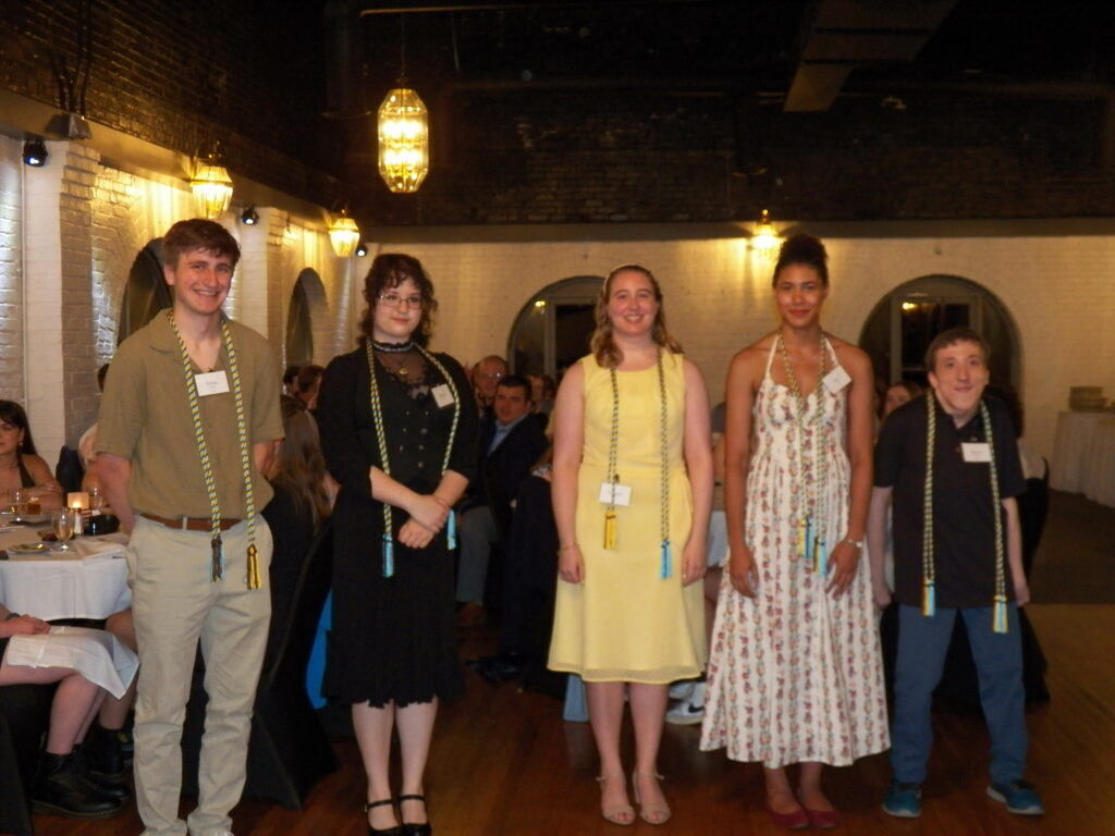 Graduating students receive their Gamma Theta Upsilon honor society cords at Spring Awards Banquet, 2026.