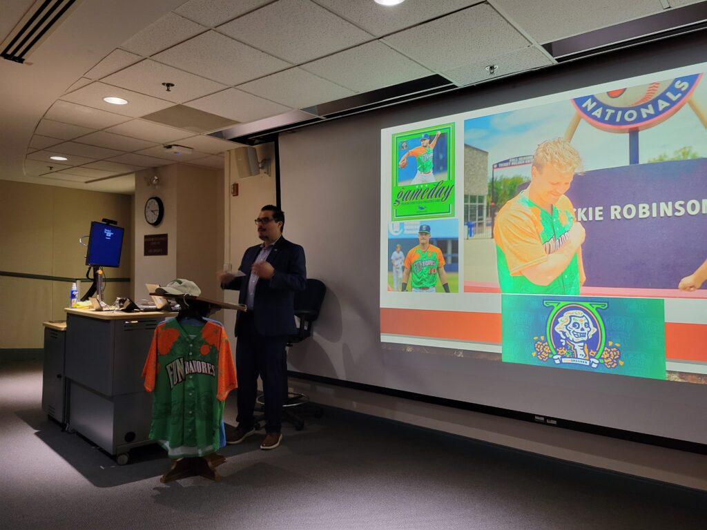A person doing a presentation about baseball.