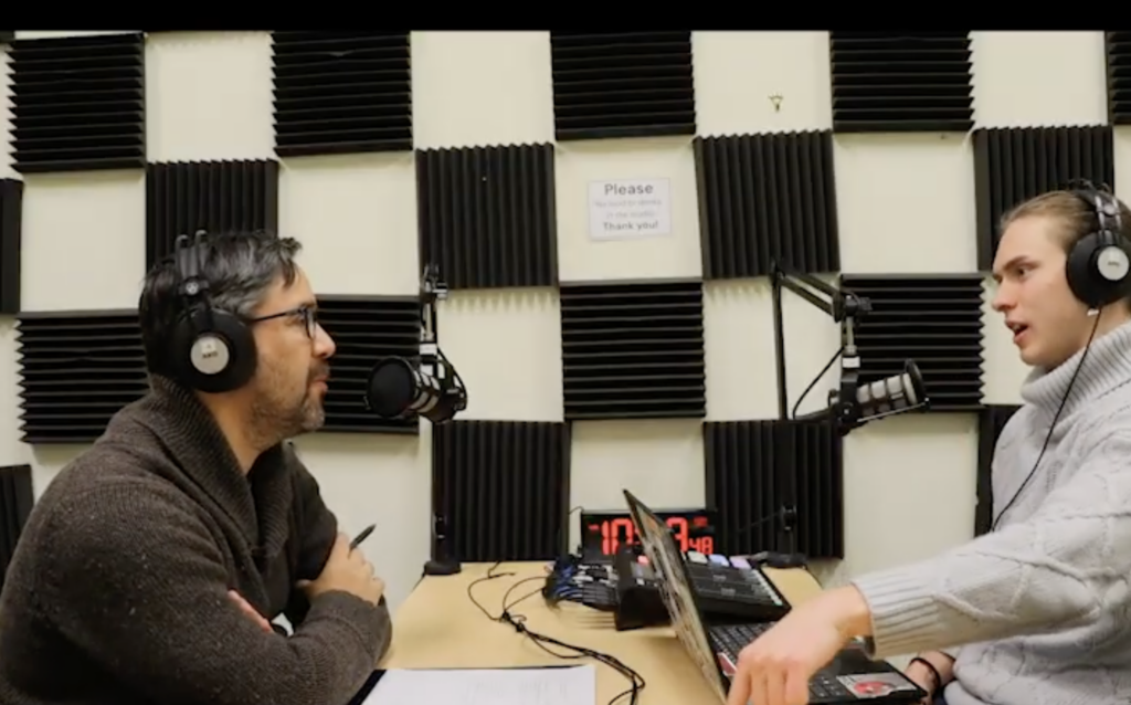 Two people recording a podcast episode in the UMW Podcast Studio.