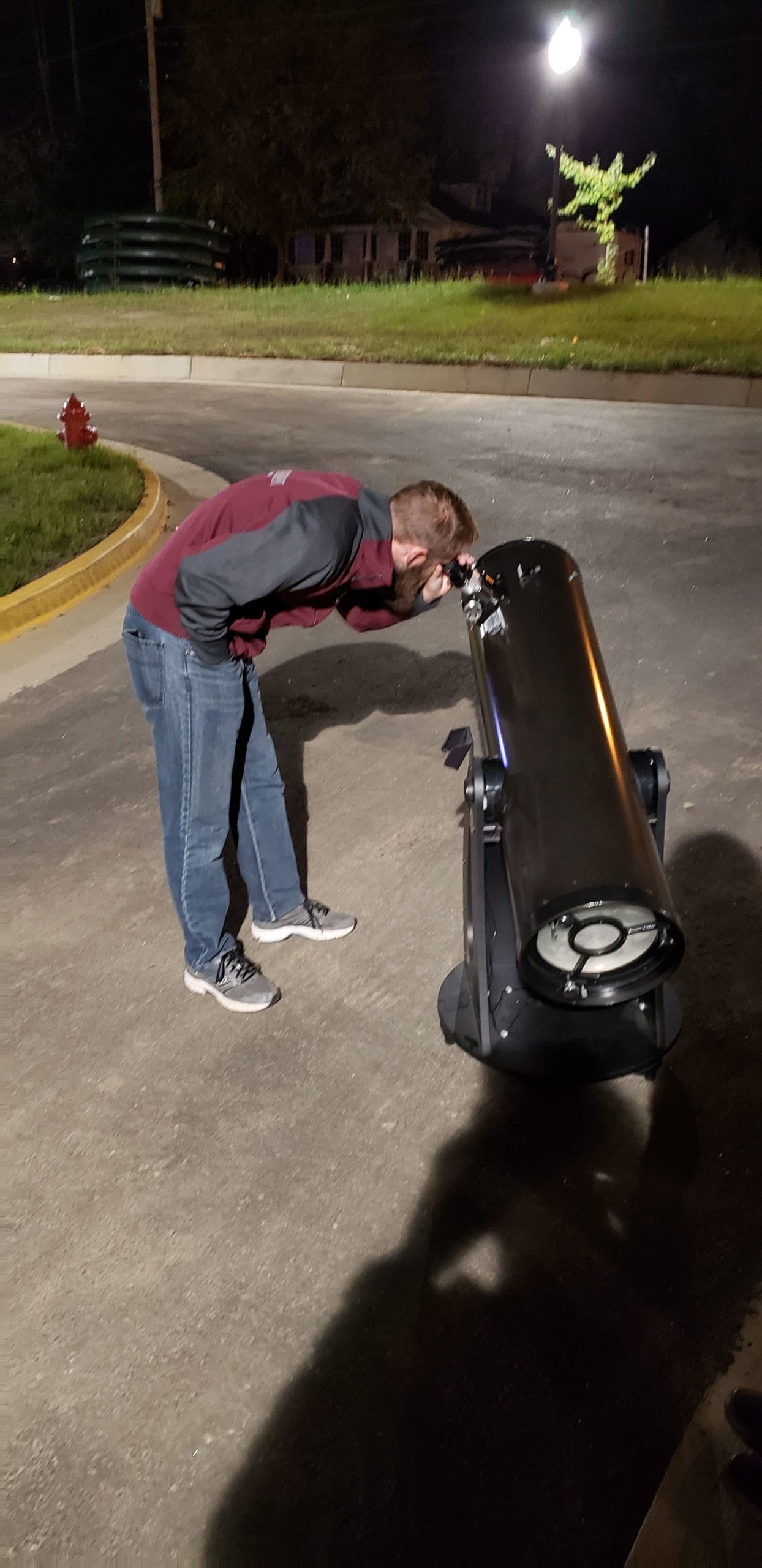 AJ Rasure 2019 SPS President setting up a telescope for astronomy night
