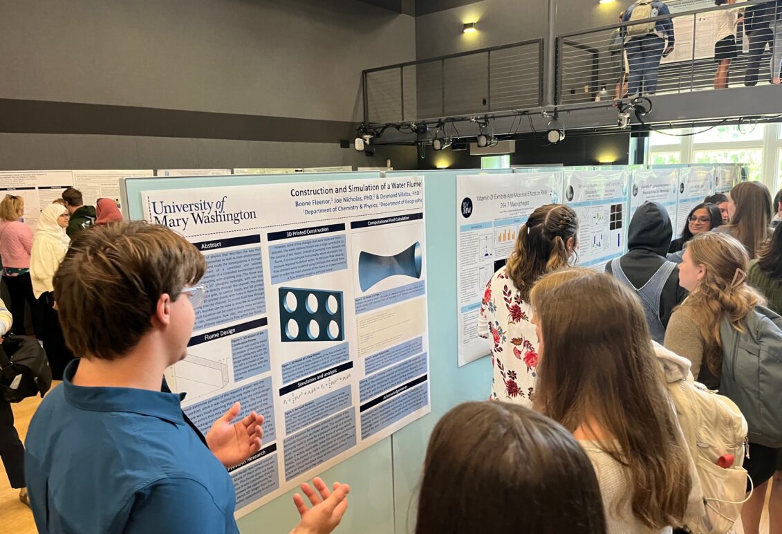 Students presenting poster research.