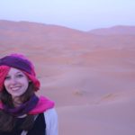 Lydia Grossman in front of a desert in Morocco.