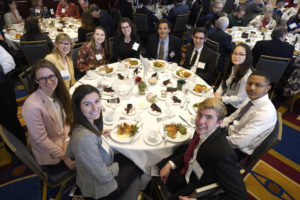 UMW students at the Northern Virginia Conservation Trust luncheon around a table with Professor Singh.